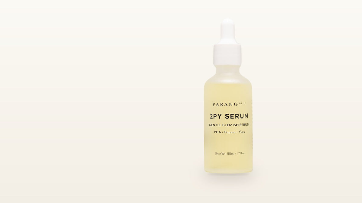 Parang Blue 2PY Serum dropper bottle on a cream background